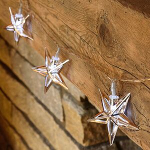 Светодиодная гирлянда на батарейках Серебряные Звезды, 1.35 м, 10 теплых белых ламп, черный ПВХ, IP20 (Star Trading, Швеция). Артикул: 728-70