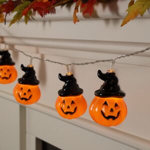 Светодиодная гирлянда на батарейках Halloween - Тыковка Джек в шляпе 1.3 м, 10 желтых LED ламп (Koopman, Нидерланды). Артикул: AMZ900020-1